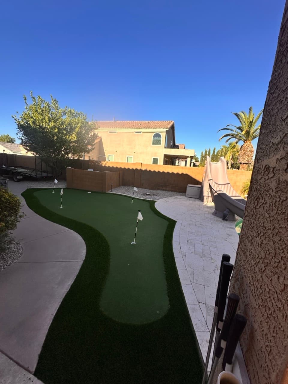 Custom backyard putting green and patio design in Mesa, AZ