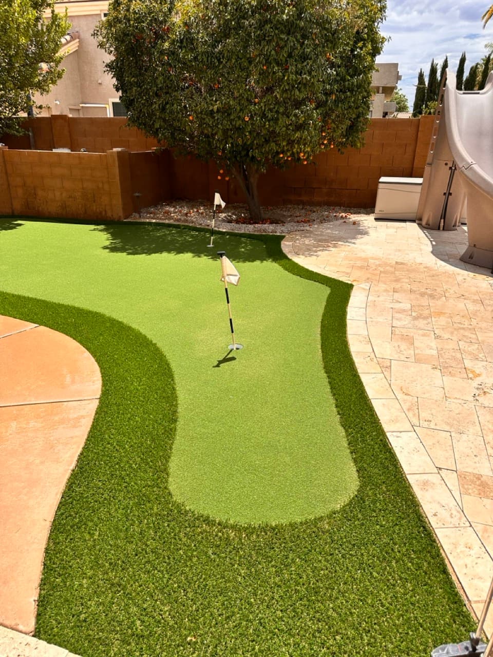 Backyard putting green with custom contours and flag pins in Mesa, AZ