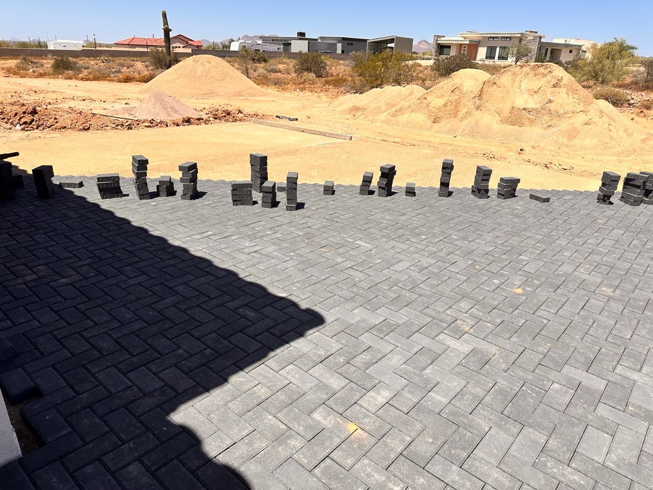 Interlocking pavers being laid in herringbone pattern in Mesa, AZ