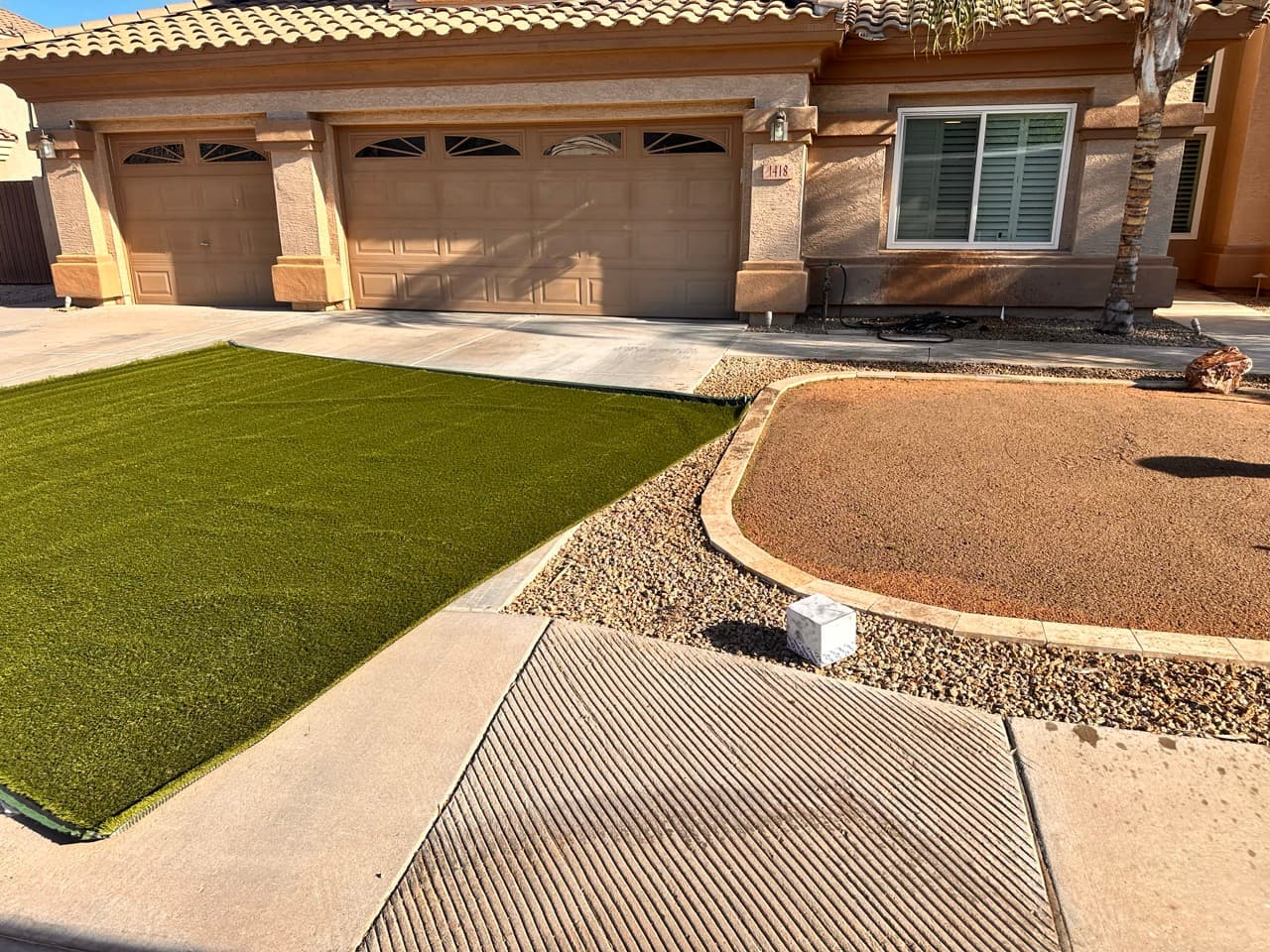 Front yard turf installation in progress showing base prep at a Mesa home